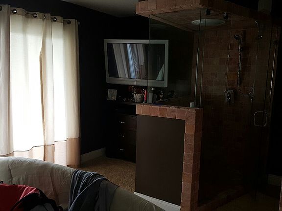 master bedroom with walk in shower
