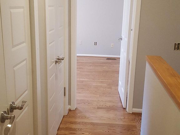 Hallway with closets between two bedrooms upstairs.