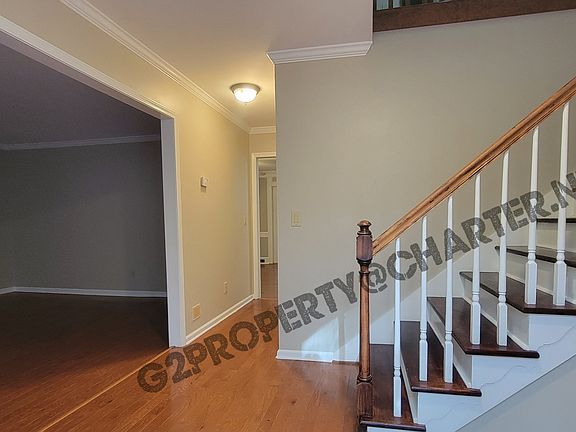 Foyer, Den to left, half bath and Family Room straight ahead. All bedrooms upstairs.