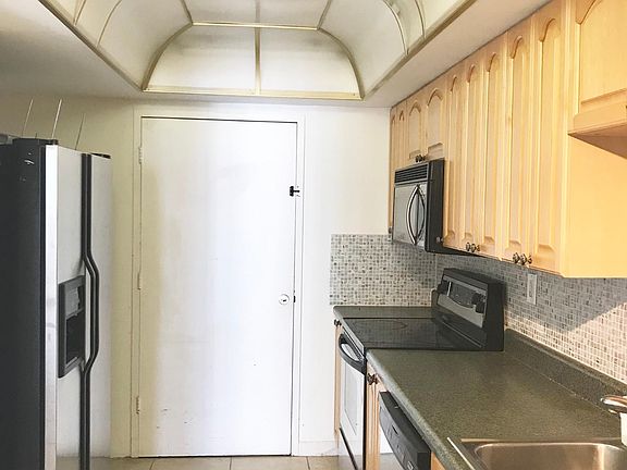 The kitchen flows into the dining room/ living room.