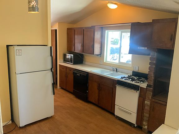 Kitchen with all appliances and Dishwasher. Large Pantry storage and Washer Dryer are located past fridge