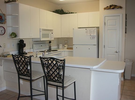 Full kitchen with Additional Seating At the Bar 