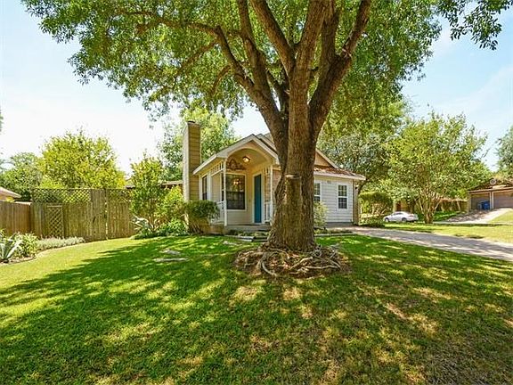 A nice shady tree welcomes guests in your new front yard.