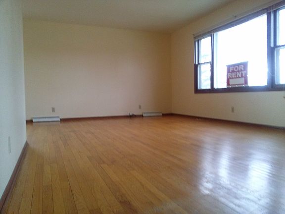 Beautiful hardwood floors throughout living room and dining