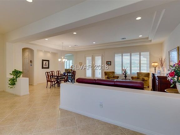 Great room with dining space. Double coffered ceiling. Double door exit do rear patio.