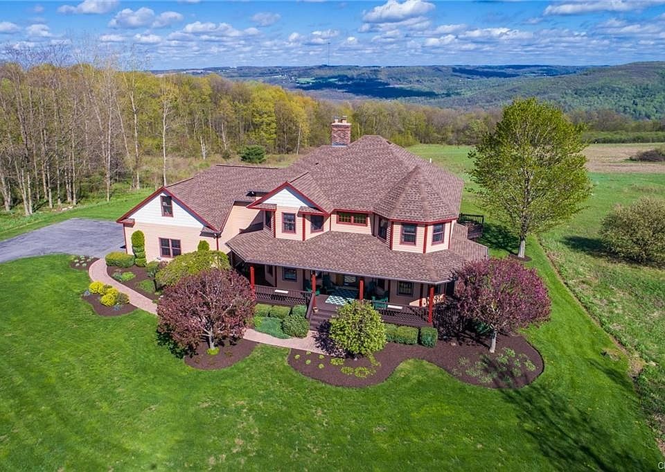 GORGEOUS VIEW ON ALMOST 5 ACRES, LANDSCAPING HAS MULTIPLE PERENNIALS FOR SPRING, SUMMER AND FALL!