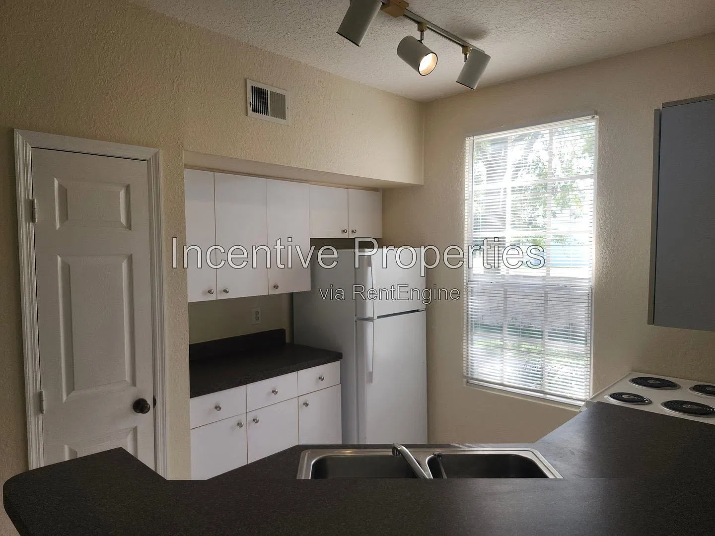 6372 Raleigh St — Photo 2