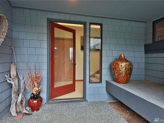As you enter this custom rambler...your eyes are drawn to the brick fireplace wall and the commanding wood beams expanding across the structure creating a warm and inviting retreat!  