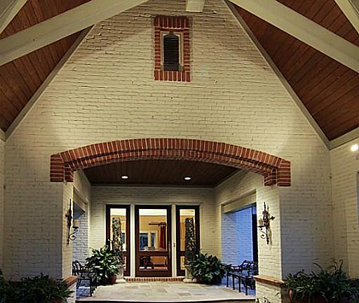 There are various ceiling treatments utilized throughout the home's interior and exterior