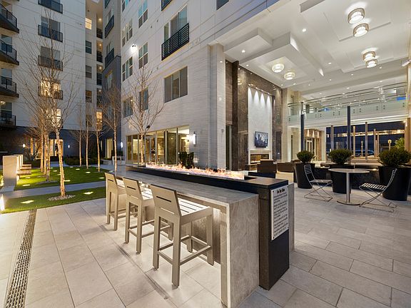 Expansive courtyard with fire features and dining areas