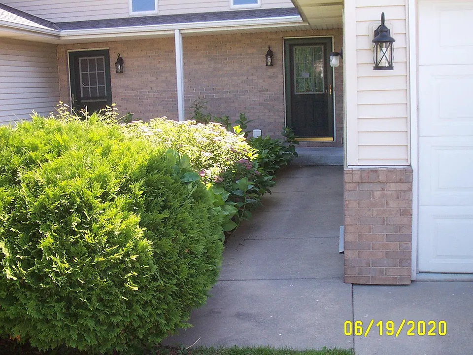 Beautiful gardens greet guests at the entryway.