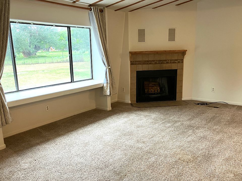 living room with view of foothills and pastures