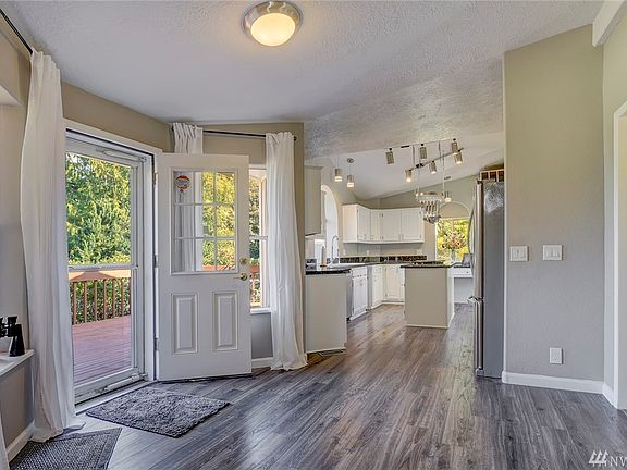 A spacious entry off the large front deck sets the tone for this home. 