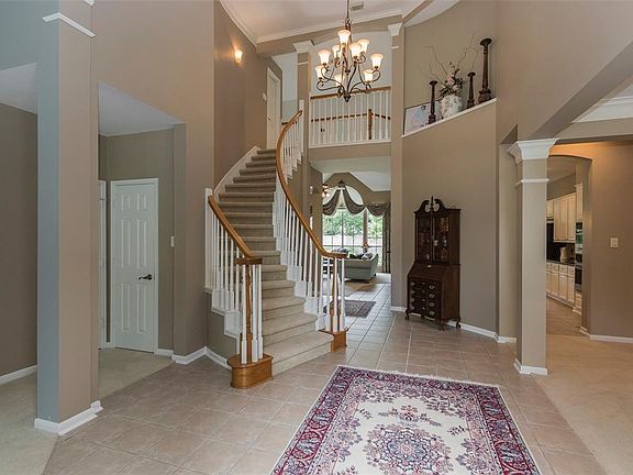 Elegant entery and fresh neutral paint.