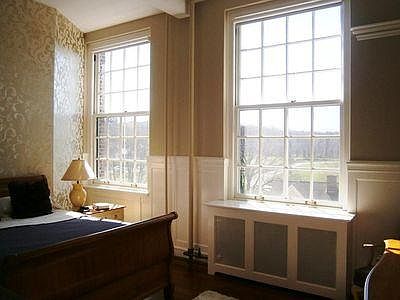 Huge windows looking out onto a park.