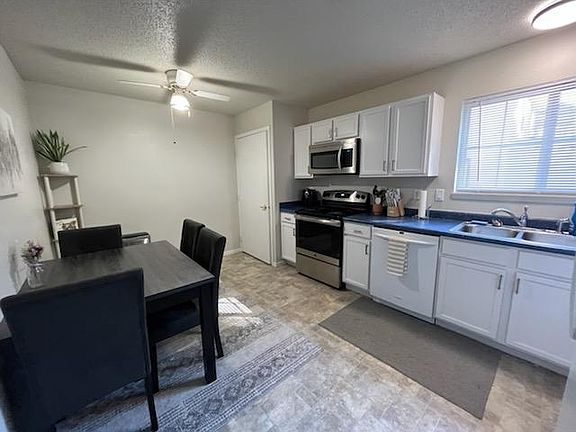 kitchen with large pantry and plenty of cupboard storage