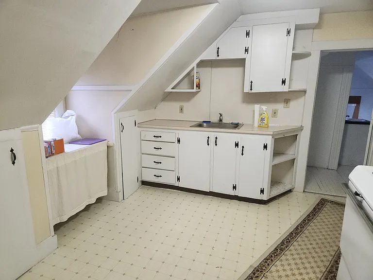 Full kitchen with cabinets stove and frig