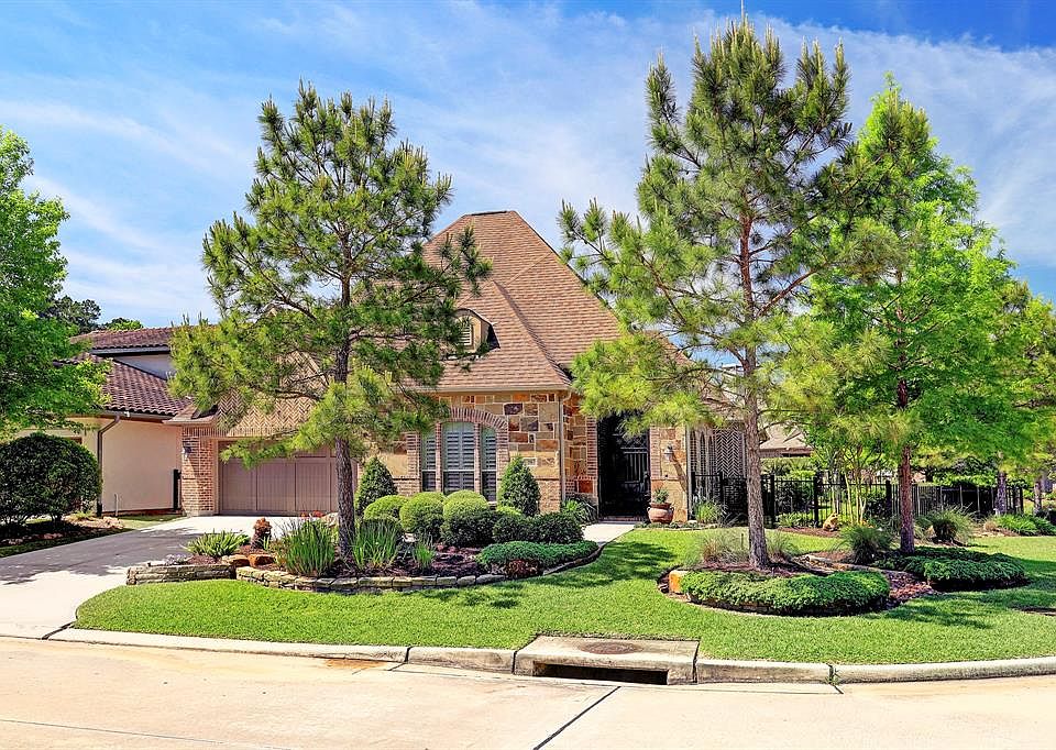 You have arrived at 79 E Crystal Canyon Ct in the prestigious Creekside area of The Woodlands. The corner, cul de sac lot is impeccably landscaped.