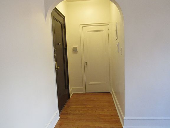 Brown Front door and white door - coat/shoes closet.