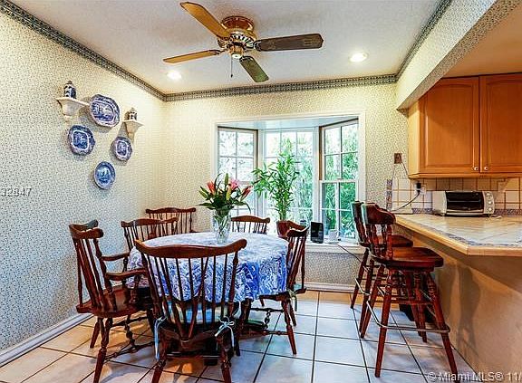 Breakfast area with Bay window overlooking lush backyard