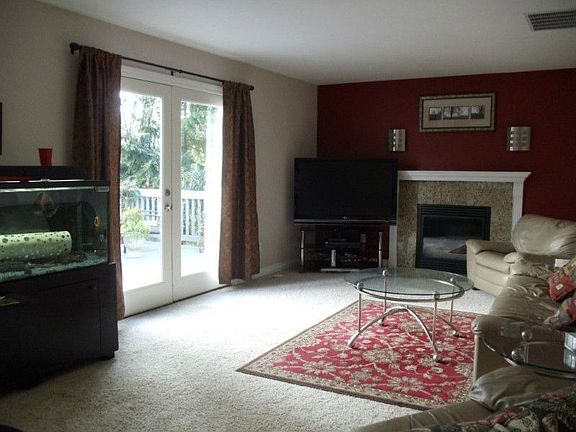 Family room with fireplace and French doors to deck area.