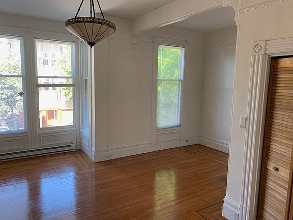 Bedroom alcove to left of living room area