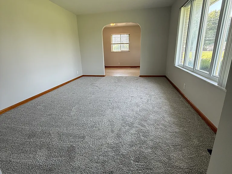 View of living room from entry way, looking towards the dining room.