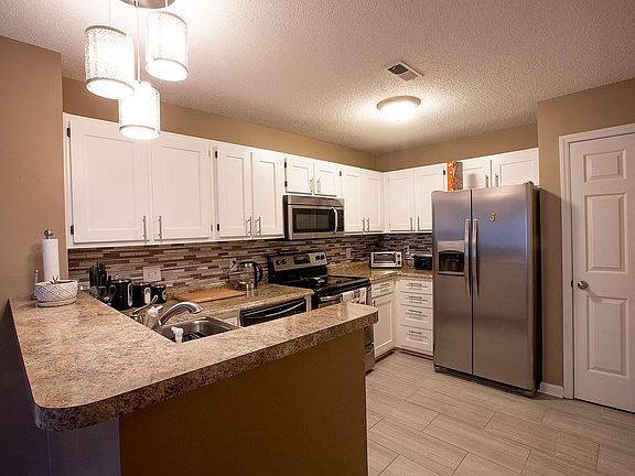 Elegant 12 x 24 porcelain tile in kitchen, dining room and laundry room