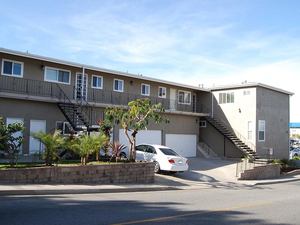 Lower unit with garage beside it and 1 parking spot infront