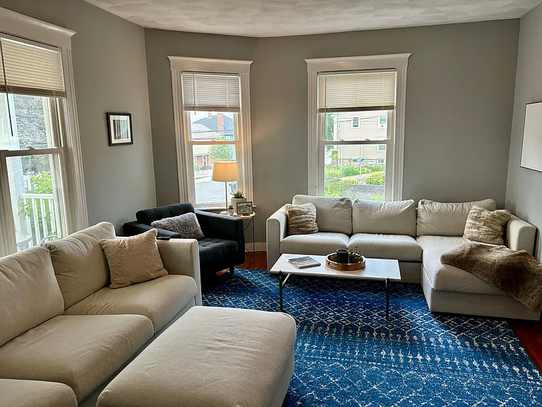 Living room with room for two sectional couches, a chair and overlooks the oceanview deck!