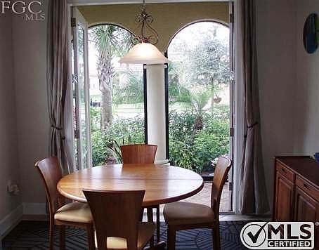 Dinette area featuring french doors leading out to your screened porch.