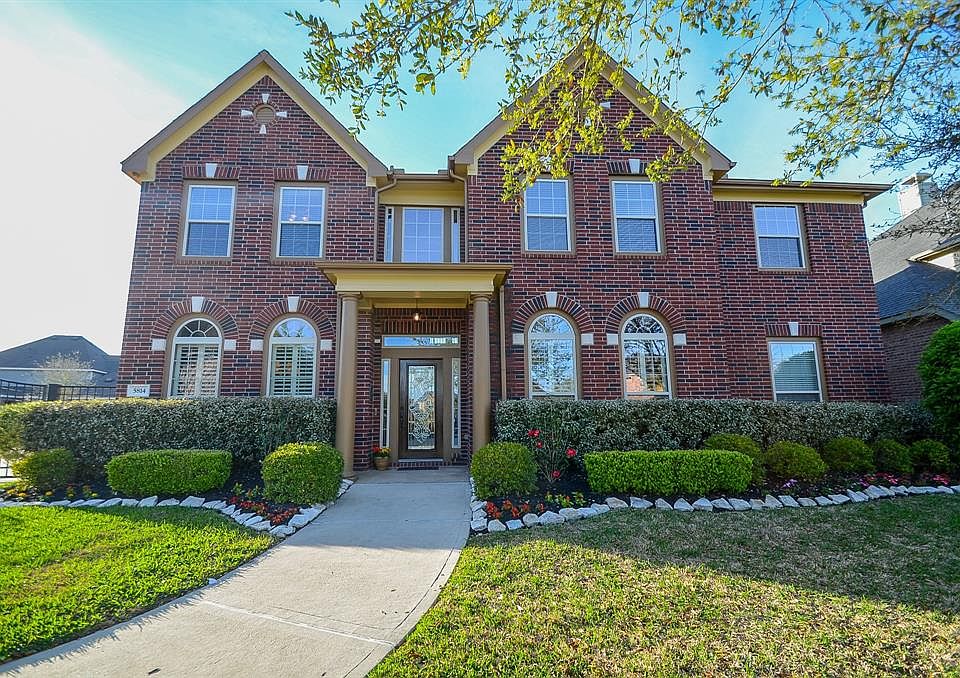 Curb appeal galore! This brick masterpiece presides beautifully over .31 acres in the desirable Cross Creek Ranch community of Fulshear.