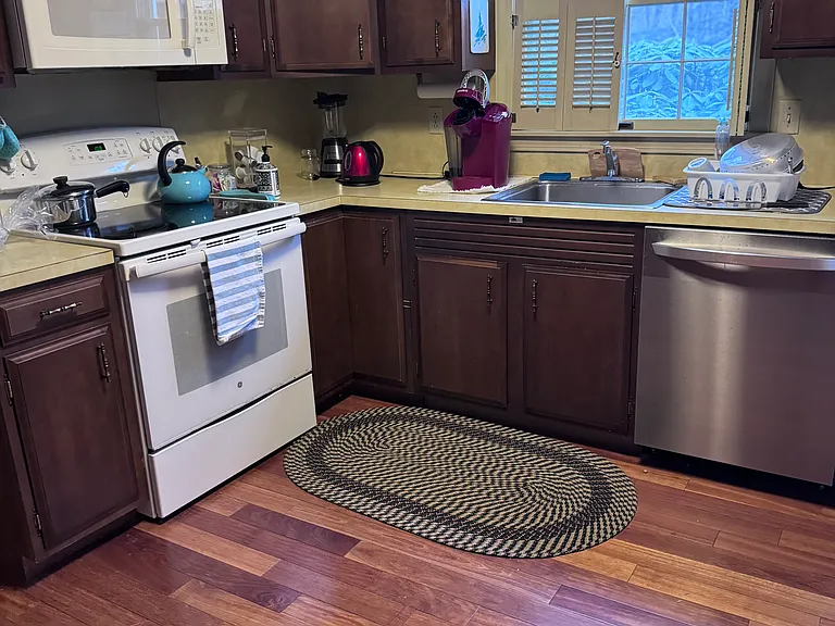 Kitchen with beautiful hardwood floors.