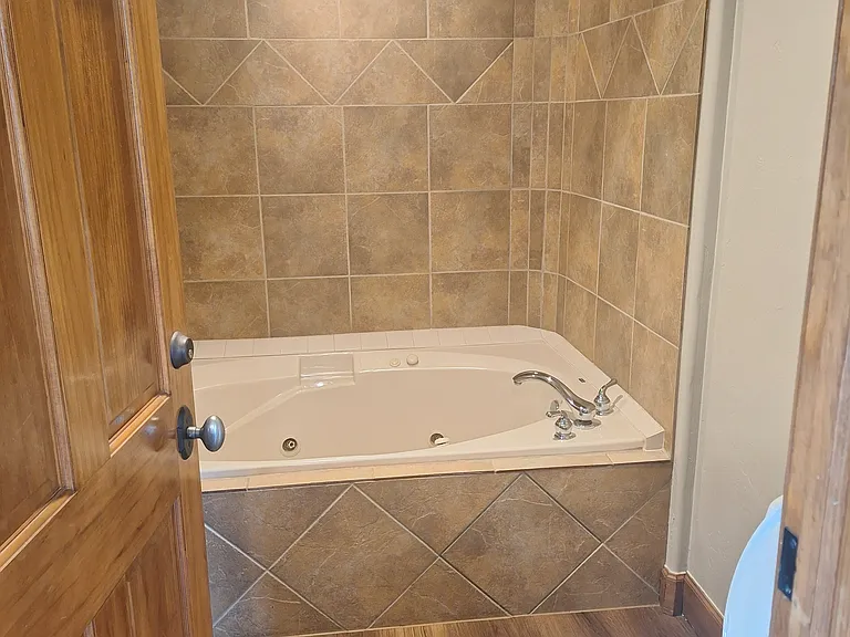 Jetted garden tub in front master bathroom.