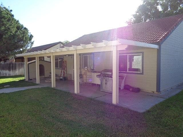 New back patio cover with lights and fan