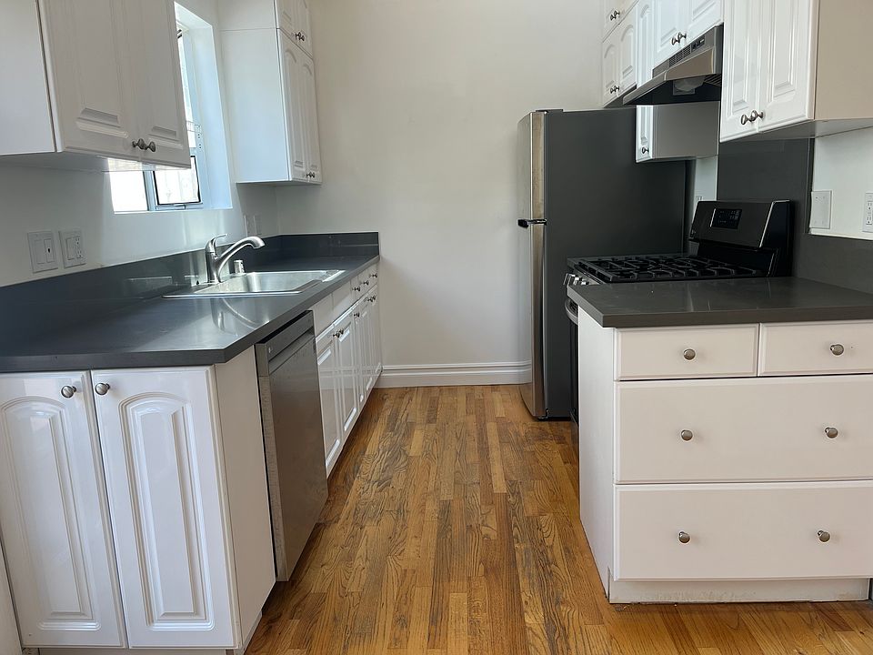 KITCHEN: NEW CABINETS, SANDSTONE COUNTERTOPS, STAINLESS STEEL APPLIANCES