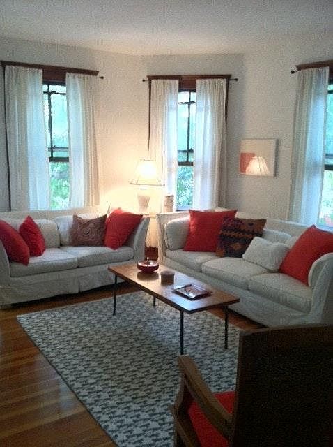 living room w bay windows and