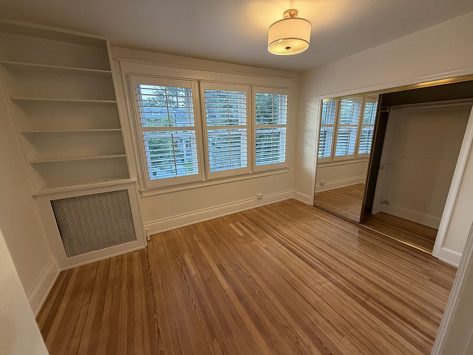Bedroom with a wall of windows and large closet
