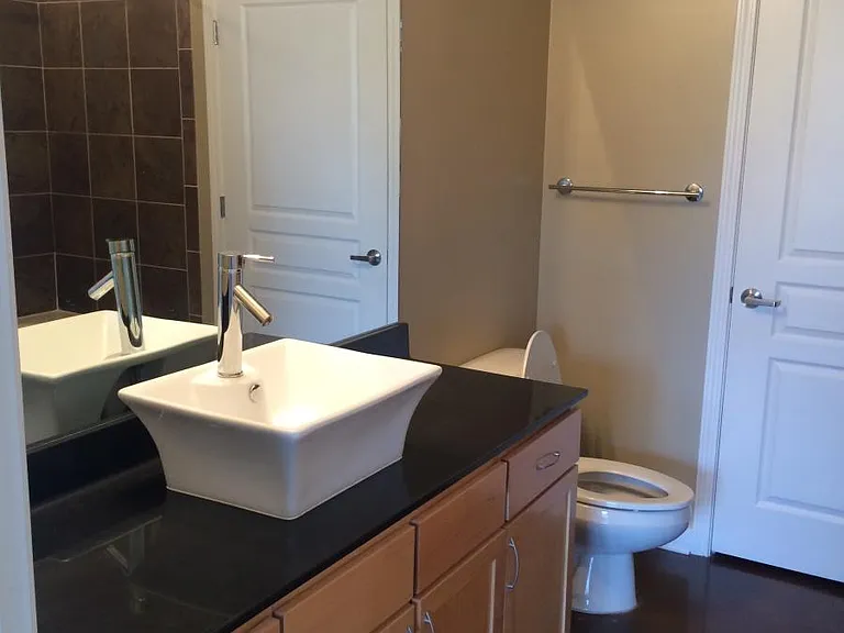 Lots of counter space in master bathroom - A new LED vanity light was put in since this picture was taken.
