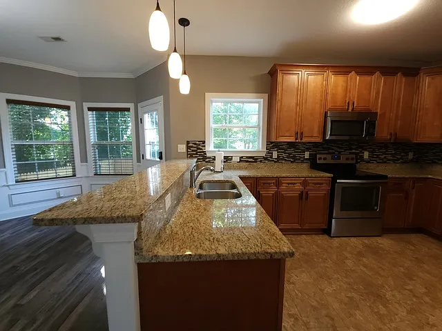 Kitchen with granite countertops and stainless appliances.