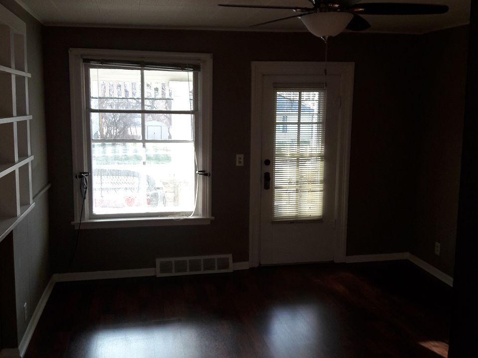 Livingroom with large bookcase and picture window