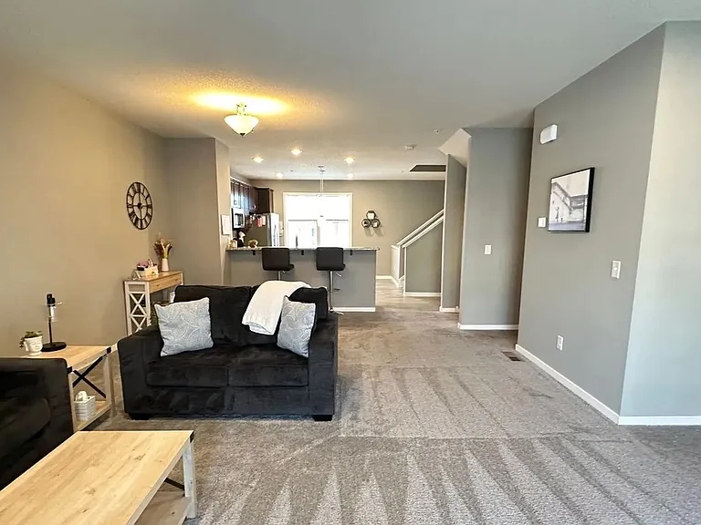 Step into the stylish comfort of LS Capital Group, featuring an inviting living space perfect for relaxation and gatherings. With modern decor and ample light, this home embodies contemporary living. Explore your future home today!