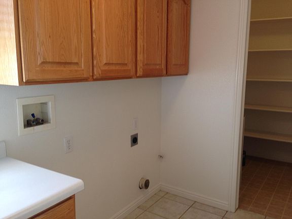 Washer/Dryer hook ups and pantry just off the large kitchen.
