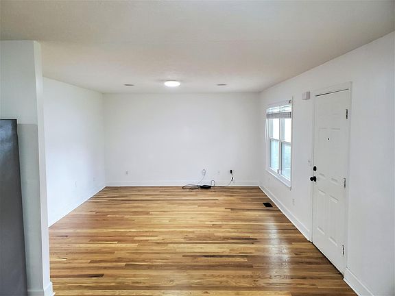 Newly remodeled home with hardwood floors in all living spaces, and clean white mosaic tile in the bathrooms. Open living, Dining, and Kitchen Area - home is already wired for Google Fiber (Fiber box is already present on site).