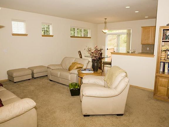 Family Room features a gas fireplace, with ceramic tile surround 