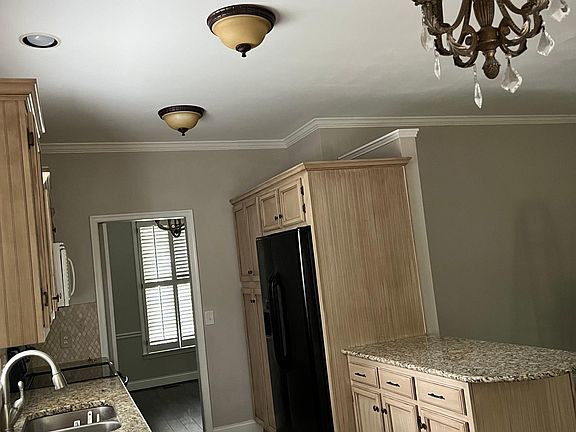 Kitchen Open to a Living Area and Fireplace