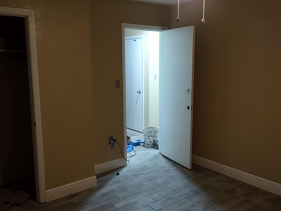 Bedroom/ office 2 New ceiling fan, paint,tile flooring and baseboard