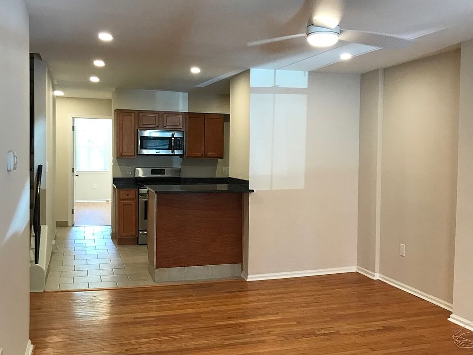 From entry facing kitchen and first floor bedroom at rear