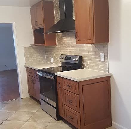 More Kitchen with new stove, cabinets, quartz counter tops,