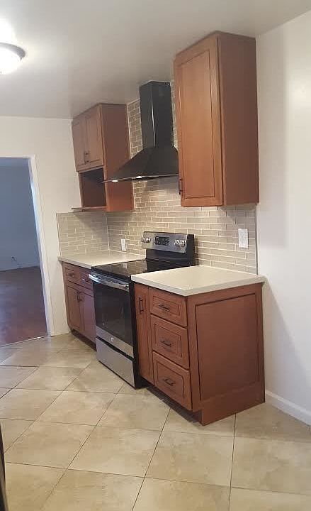 More Kitchen with new stove, cabinets, quartz counter tops,